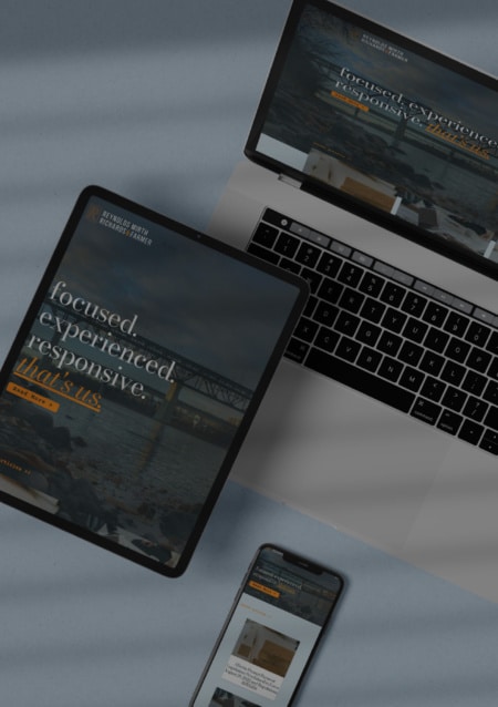 Sample of Reynolds Mirth's website on a landing page, on a website, tablet and a phone.